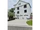 Charming three-story home features white siding, black shutters, and a three-car garage at 17 Carson Creek Dr., Murrells Inlet, SC 29576