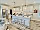 Modern kitchen with stainless steel appliances, quartz countertops, and island seating at 17 Carson Creek Dr., Murrells Inlet, SC 29576