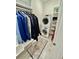 Laundry room with washer and dryer combo and storage shelves at 17 Carson Creek Dr., Murrells Inlet, SC 29576