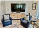 Inviting living room with comfortable seating, modern entertainment center, and stylish decor at 17 Carson Creek Dr., Murrells Inlet, SC 29576