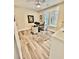 Bright office with two windows and an eye-catching rug beneath the desk area at 17 Carson Creek Dr., Murrells Inlet, SC 29576