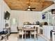 Covered outdoor kitchen featuring a grill, counterspace, and a dining table at 17 Carson Creek Dr., Murrells Inlet, SC 29576