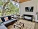 Relaxing screened porch with comfortable seating and scenic views of lush trees and water at 17 Carson Creek Dr., Murrells Inlet, SC 29576