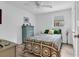 Bright bedroom featuring a ceiling fan, a window, and neutral decor at 1870 Auburn Dr. # 22A, Surfside Beach, SC 29575