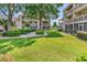 Exterior shot showcasing a well-manicured lawn and mature trees at 1870 Auburn Dr. # 22A, Surfside Beach, SC 29575
