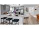 Modern kitchen with gray cabinets, quartz counters, bar seating, and stainless steel appliances at 1870 Auburn Dr. # 22A, Surfside Beach, SC 29575