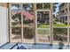 Screened patio view highlighting a landscaped courtyard with an American flag at 1870 Auburn Dr. # 22A, Surfside Beach, SC 29575