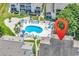 Aerial view of a kidney-shaped community pool and jacuzzi area with lounge chairs at 1870 Auburn Dr. # 22A, Surfside Beach, SC 29575