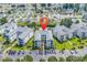 Aerial view showcasing a complex, parking, landscaping, and surrounding neighborhood with ponds at 2020 Cross Gate Blvd. # 203, Surfside Beach, SC 29575