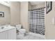 Bathroom featuring a white vanity, toilet, and shower with striped curtain at 2020 Cross Gate Blvd. # 203, Surfside Beach, SC 29575