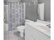 Clean bathroom showcasing a shower/tub combo, toilet, and vanity with white cabinetry at 2020 Cross Gate Blvd. # 203, Surfside Beach, SC 29575