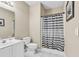 Bathroom with a white vanity, toilet, and shower featuring a striped shower curtain at 2020 Cross Gate Blvd. # 203, Surfside Beach, SC 29575
