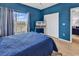 Cozy bedroom featuring a window with a view, television, and closet with white doors at 2020 Cross Gate Blvd. # 203, Surfside Beach, SC 29575