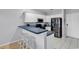 Functional kitchen with stainless steel appliances, white cabinets and a breakfast bar at 2020 Cross Gate Blvd. # 203, Surfside Beach, SC 29575