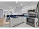 Charming kitchen with modern appliances, white cabinets, and a seamless open floorplan at 2020 Cross Gate Blvd. # 203, Surfside Beach, SC 29575
