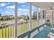 Inviting patio view of pool area, complete with furnishings and fan, for ultimate relaxation at 2020 Cross Gate Blvd. # 203, Surfside Beach, SC 29575
