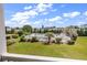 Community pool area with lush landscaping and clear blue skies, creating a relaxing atmosphere at 2020 Cross Gate Blvd. # 203, Surfside Beach, SC 29575