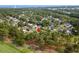 An aerial view of a home located in a lush, green, wooded neighborhood at 2077 N Berwick Dr., Myrtle Beach, SC 29575