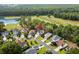An aerial view of a home located in a neighborhood next to a golf course and lake at 2077 N Berwick Dr., Myrtle Beach, SC 29575