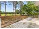 This backyard boasts a wooden deck with views of the landscaped property and golf course at 2077 N Berwick Dr., Myrtle Beach, SC 29575
