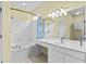 Bright bathroom with a tub, shower, large vanity, and tile floors at 2077 N Berwick Dr., Myrtle Beach, SC 29575