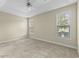 Spacious bedroom features carpeted floors, two windows, and a ceiling fan at 2077 N Berwick Dr., Myrtle Beach, SC 29575