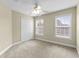 This bedroom boasts natural light, a ceiling fan and neutral colored walls at 2077 N Berwick Dr., Myrtle Beach, SC 29575
