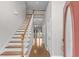 A bright foyer features hardwood floors, a staircase, and natural light at 2077 N Berwick Dr., Myrtle Beach, SC 29575