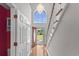 Bright foyer features hardwood floors, a grand chandelier, and front door view at 2077 N Berwick Dr., Myrtle Beach, SC 29575
