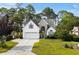 Charming two-story home boasts a manicured lawn and attached two car garage at 2077 N Berwick Dr., Myrtle Beach, SC 29575