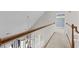 Upstairs hallway overlooks the living room and has wood railing at 2077 N Berwick Dr., Myrtle Beach, SC 29575