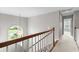 Upstairs hallway features wood railing and chandelier view at 2077 N Berwick Dr., Myrtle Beach, SC 29575