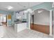Bright eat-in kitchen with island, tile floors, and doorway to living room at 2077 N Berwick Dr., Myrtle Beach, SC 29575