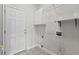 This is a functional laundry room featuring storage cabinets and laundry hookups at 2077 N Berwick Dr., Myrtle Beach, SC 29575