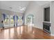 Bright living room with vaulted ceiling, hardwood floors, fireplace, and large windows at 2077 N Berwick Dr., Myrtle Beach, SC 29575