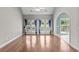 Living room with hardwood floors, bright windows, and patio access at 2077 N Berwick Dr., Myrtle Beach, SC 29575