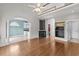 Open living room with hardwood floors, fireplace, and view of the kitchen and entryway at 2077 N Berwick Dr., Myrtle Beach, SC 29575