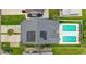 Aerial view of a modern home with solar panels and dual swimming pools at 213 South Myrtle Dr., Surfside Beach, SC 29575