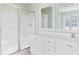 Bright bathroom features white cabinetry, a glass-enclosed shower, and ample natural light at 213 South Myrtle Dr., Surfside Beach, SC 29575