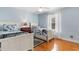 Charming bedroom with two twin beds, blue accents, and a bright window at 213 South Myrtle Dr., Surfside Beach, SC 29575