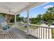 Inviting front porch with rocking chairs and views of the neighborhood at 213 South Myrtle Dr., Surfside Beach, SC 29575