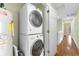 Stacked laundry units and water heater in hallway of home at 213 South Myrtle Dr., Surfside Beach, SC 29575