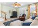 Comfortable living room features stylish decor, tile flooring, and a staircase leading to the upper level at 213 South Myrtle Dr., Surfside Beach, SC 29575