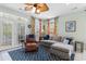 Cozy living room with comfortable seating, stylish decor, and ample natural light creates an inviting atmosphere at 213 South Myrtle Dr., Surfside Beach, SC 29575