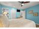 Comfortable bedroom showcasing a soft bed, ceiling fan, and views into the bathroom and kitchen, enhancing its appeal at 223 Maison Dr. # B-8, Myrtle Beach, SC 29572