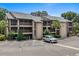 Multi-story condo building with balconies, parking, and landscaping on a bright, sunny day at 223 Maison Dr. # B-8, Myrtle Beach, SC 29572