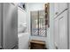Functional laundry area with a stacked washer/dryer unit, shelving, and a window that allows for natural light at 223 Maison Dr. # B-8, Myrtle Beach, SC 29572