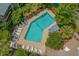 Aerial view of community pool with lounge chairs and lush landscaping surrounding the area at 223 Maison Dr. # B-8, Myrtle Beach, SC 29572