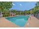 Inviting outdoor pool surrounded by lush greenery, offering a refreshing retreat for residents and guests at 223 Maison Dr. # B-8, Myrtle Beach, SC 29572