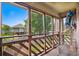 Scenic screened porch with exterior view, ceiling fan, and outdoor furniture to enjoy the outdoors at 223 Maison Dr. # B-8, Myrtle Beach, SC 29572